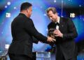 Ronaldo Nazario presenting the 2026 Ballon d'Or trophy to Harry Kane on stage